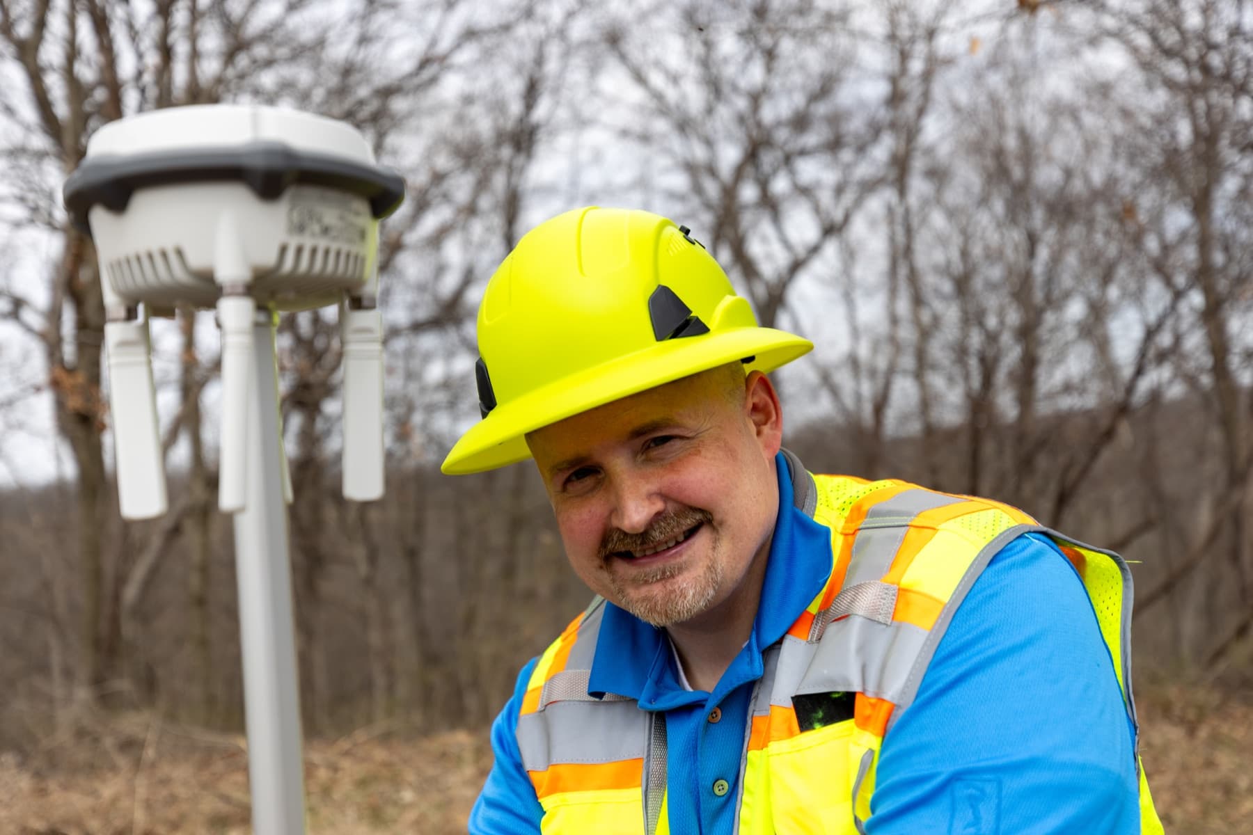 Jonathan Scrivner working beside GNSS survey equipment